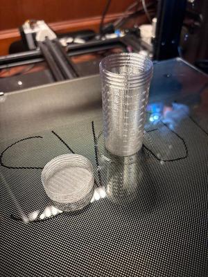 Water permeable container for passive activated carbon filtering